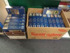 Two boxes containing 16 Gibson's Thomas Kinkade jigsaws.