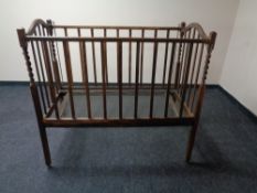 An Edwardian oak barley twist cot