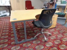 An L-shaped computer work station with three drawer under desk chest and fabric adjustable chair