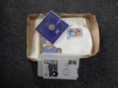 A box of Royal Family first day covers,