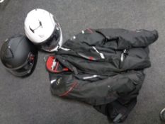 Two MT motorcycle helmets together with a motorcycle jacket.