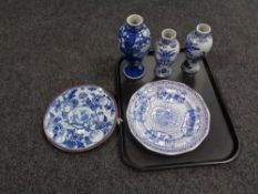 A tray containing three Chinese blue and white vases together with two antique blue and white