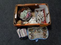 A box of antique doll, china and metal thimbles, racks,