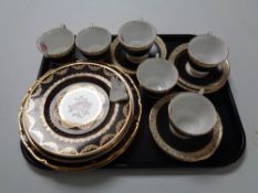 A tray containing six Royal Stafford pink rose patterned teacups and saucers together with similar