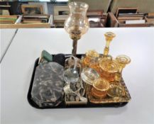 A tray of brass candle holder with glass shade, cased Art Deco manicure set,