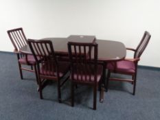 A late 20th century Danish Mobler extending dining table with two leaves and a set of six rail back