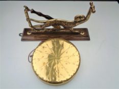 An early twentieth century dinner gong and beater on wall bracket modelled as a monkey