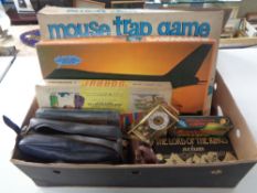 A box of vintage board games, Mouse Trap, Lord of the Rings box set,