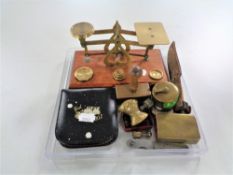 A set of vintage brass postal scales with weights, vesta cases, brass trench art matchbox holder,
