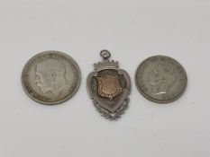 A silver fob marked RSAF Football League Winners 1918-19,