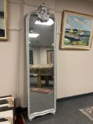 A silvered crested mirror, height 207 cm.