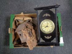 A box containing a contemporary battery operated wall clock in fitted cabinet together with a