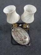 A silver plated twin handled try containing cake slices and tongs,