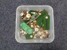 A tub of cap badges,