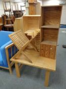 A teak X-frame magazine rack together with a folding table,