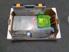 A box containing fishing equipment to include lures, line hooks, plastic cases etc.