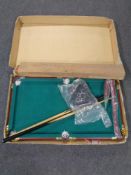 A child's table top snooker table with accessories, together with a bull worker.