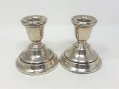 A pair of silver dwarf candlesticks, Birmingham marks, height 8cm.