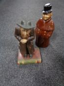 An Aynsley Dickens Series figure, Fagin, together with a Royal Doulton china decanter.