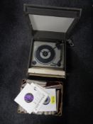 A mid 20th century BSR electric table top record player together with a box containing a large