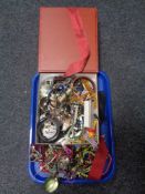A tray containing a large quantity of assorted costume jewellery to include bangles,