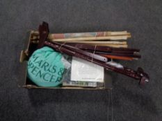 A box containing vintage knitting patterns, tapestry stand and frame, tapestries.