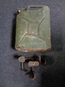 A 20 litre jerry can together with two cobbler's lasts.