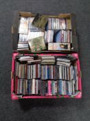 Two boxes containing assorted CDs.