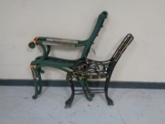 Two pairs of cast iron bench ends.