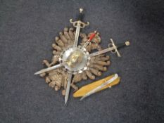 Three ornamental Spanish swords mounted on wooden shield,