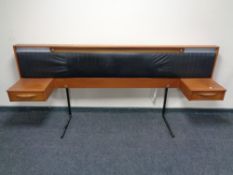 A mid 20th century Austin suite teak continental headboard.