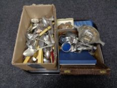 A tray of a quantity of boxed and unboxed stainless steel and plated cutlery together with a plated
