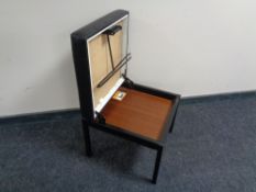 A mid 20th century Variett Valett stool upholstered in black vinyl on metal legs.