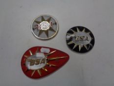 A 20 litre jerry can together with three vintage BSA motorcycle badges.