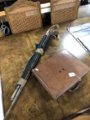 A bundle of antique and later walking sticks, umbrellas, horn and silver handled examples,