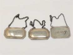 Three silver decanter labels