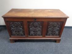 A 19th century carved oak coffer.