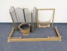 An antique brass extending fire curb and coal bucket,