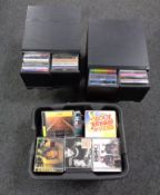 A box and two sets of storage drawers containing assorted CDs.