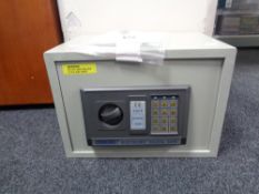 A Pregex electronic digital safe with keys.