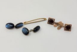 A pair of rose metal cuff links, apparently unmarked,