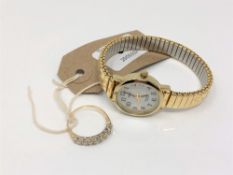 A 9ct gold half eternity ring set with cubic zirconia together with a gilt metal wrist watch.