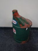 A 20th century large green oil can bearing Esso and Texaco stickers.