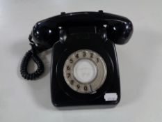 A black Bakelite cased telephone