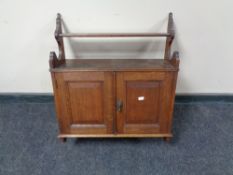 An Edwardian double door oak wall cabinet, fitted two internal drawers.