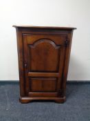 A good quality oak single door corner cabinet.