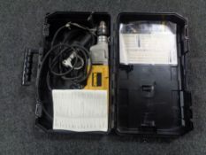 A cased Dewalt hammer drill.