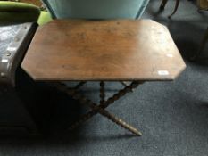 An early twentieth century folding table on bobbin legs