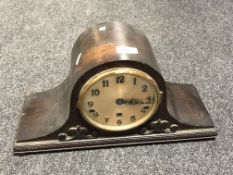 A 1930s oak cased continental mantel clock.