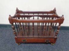 A Canterbury on brass castors